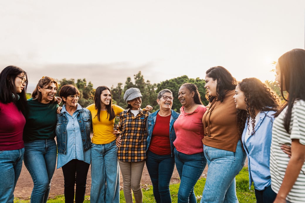 Happy multigenerational group of women with different ages and e